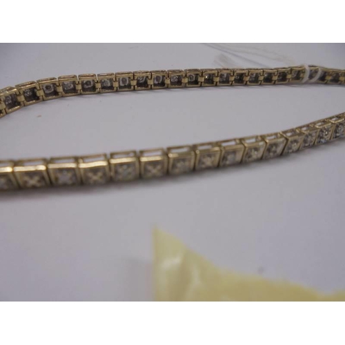 1014 - A yellow gold square set diamond bracelet, 7.7 grams.