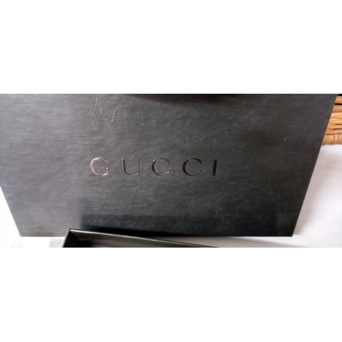 1257 - A Gucci purse in box