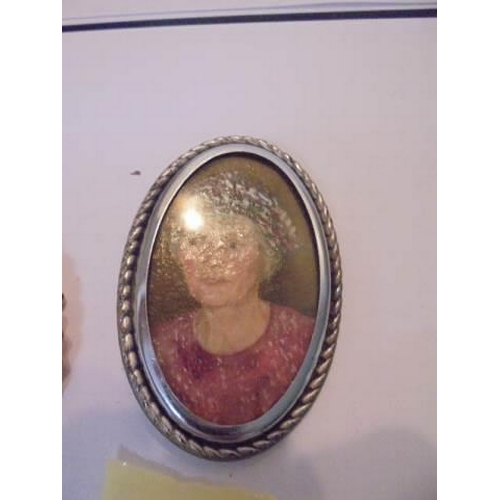 1038 - An old cameo of a young woman, an oil miniature of a woman and a carved bone antique brooch,.