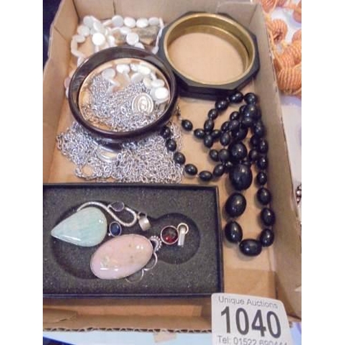 1040 - A quantity of stylist necklaces, pendants, mother of pearl bracelets etc.,