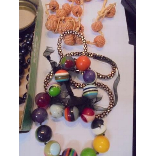 1040 - A quantity of stylist necklaces, pendants, mother of pearl bracelets etc.,