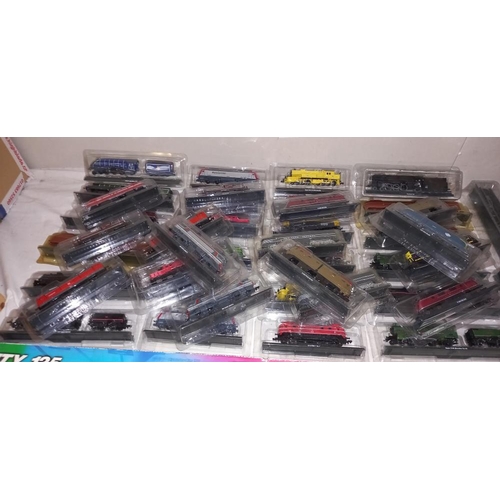 2337 - A quantity of unpowered 'N' Gauge model trains in packaging