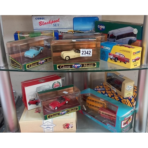 2342 - 2 shelves of Corgi classics including MGA Jaguar triumph & Mini cooper etc