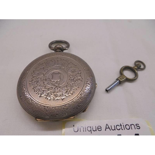 1044 - A silver pocket watch marked fine silver, S S & C C, 38519, E Crouch, North Brixton, in working orde... 