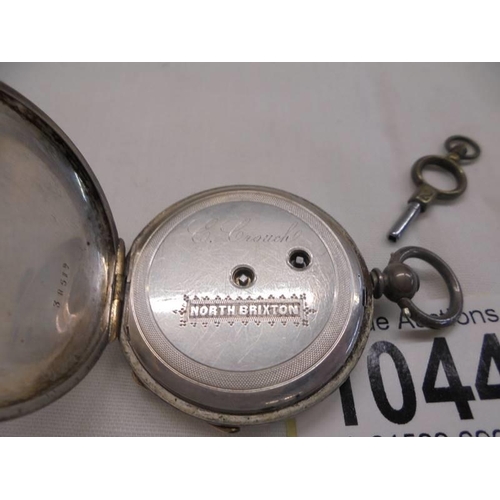 1044 - A silver pocket watch marked fine silver, S S & C C, 38519, E Crouch, North Brixton, in working orde... 