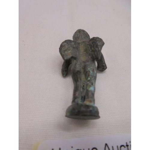 1057 - A small Roman bronze of Eros.