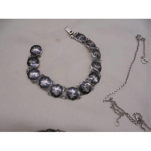 1062 - A good lot of silver bracelets, pendant etc.,