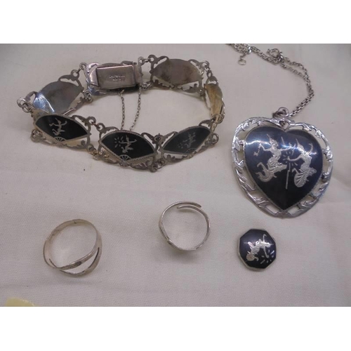 1062 - A good lot of silver bracelets, pendant etc.,