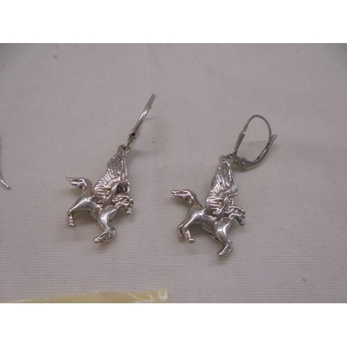 1063 - A pair of silver pendant earrings and a pair of silver Pegasus earrings.