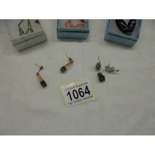 1064 - Six pairs of pendant earrings and three odds.