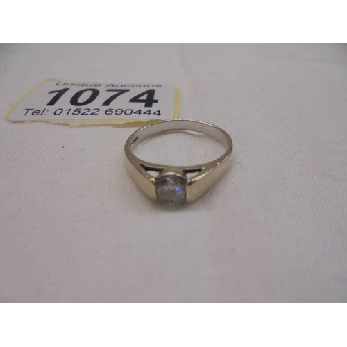 1074 - A 9ct solitaire ring size O, 2.8 grams and a mis-shaped 9ct gold ring, 2 grams.