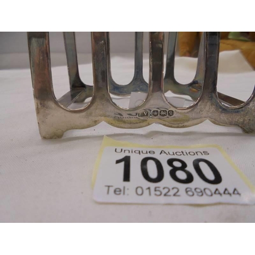 1080 - A hall marked silver toast rack.