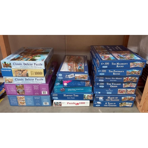 2362 - A large quantity of jigsaws many unopened (inside)