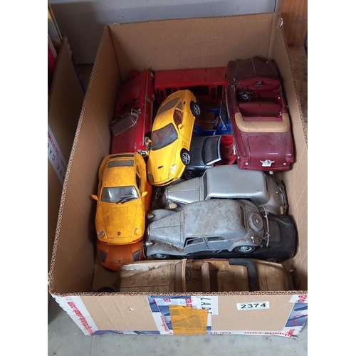 2374 - A quantity of large scale die cast model cars, in as found condition