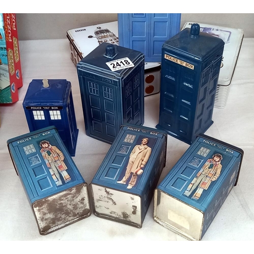 2418 - A quantity of Doctor Who Tardis's including tins & pottery money boxes