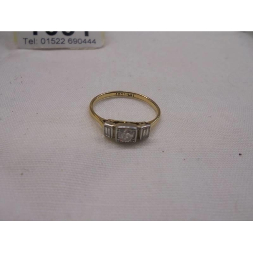 1091 - An 18ct gold and platinum three stone ring, size N half, 2 grams.