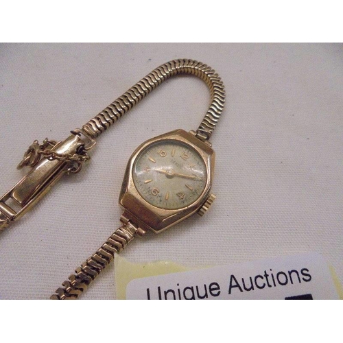 1095 - A 9ct gold ladies wrist watch, total weight 15.85 grams.