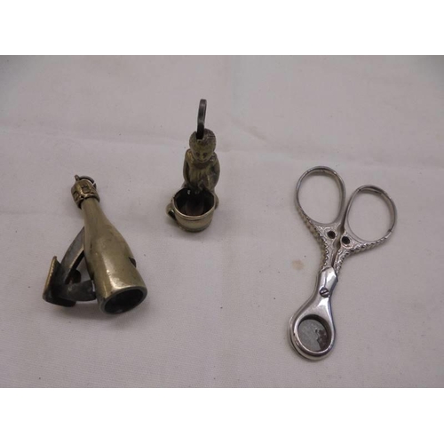 1114 - Two Victorian novelty cigar cutters and one other.