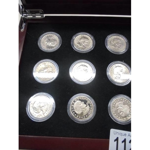 1121 - A cased set of fifteen Susan B Anthony dollars.