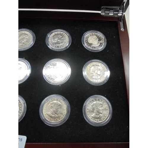 1121 - A cased set of fifteen Susan B Anthony dollars.