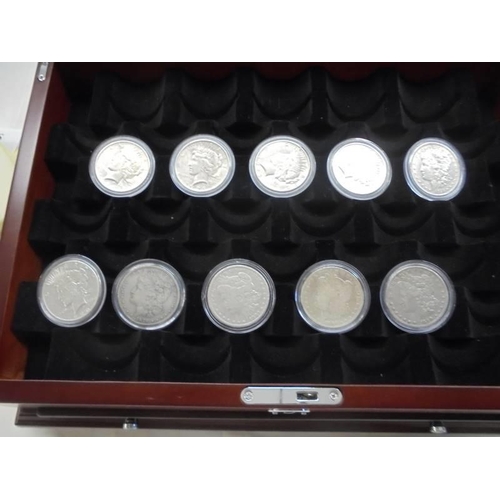 1122 - A collection of ten Morgan silver dollars in case, 1879, 1882, 1891, 1899, 1921 - 1926.