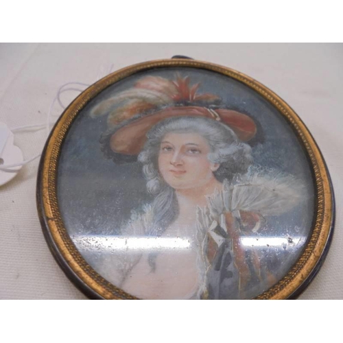 1132 - A miniature oval portrait of  a lady, 8 x 6.75 cm.