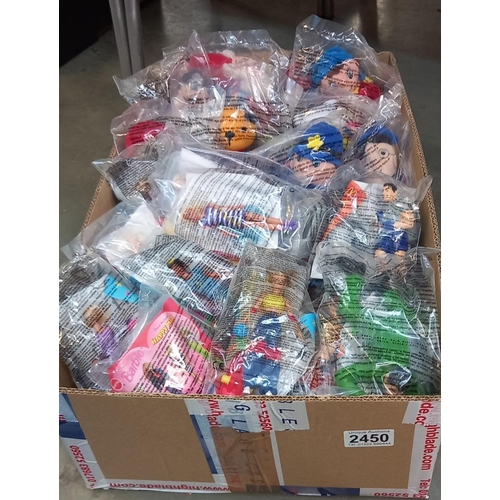 2450 - A quantity of McDonalds Happy meal toys including Barbie, Action man, Noddy, Sooty & Sweep etc