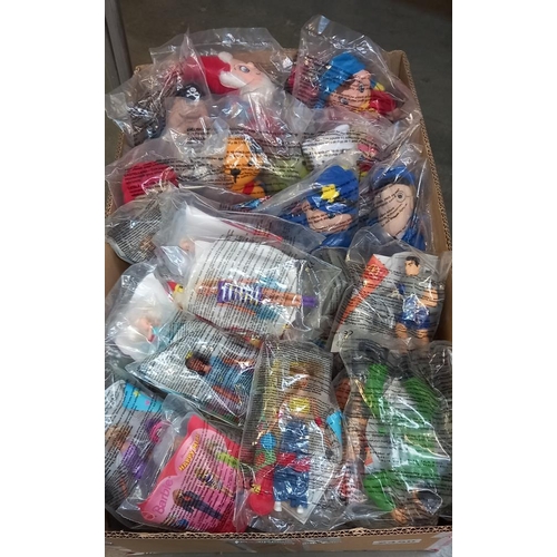 2450 - A quantity of McDonalds Happy meal toys including Barbie, Action man, Noddy, Sooty & Sweep etc