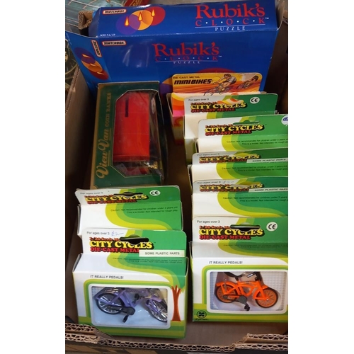 2452 - 8 x Zylmex boxed diecast city cycles, bicycles & A matchbox Rubik's clock