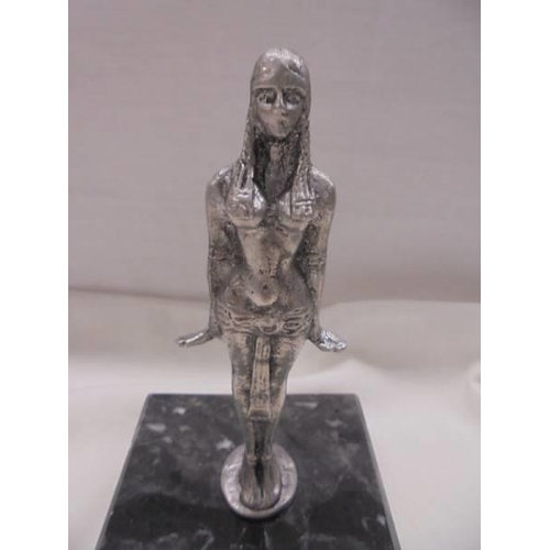 1142 - A white metal Art Deco style figure of an Egyptian, 12.5 cm tall.