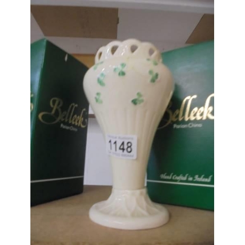 1148 - A boxed pair of Belleek vases.