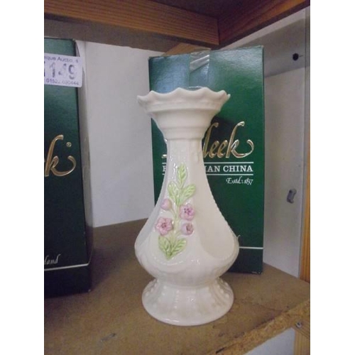 1149 - Two boxed Belleek vases.