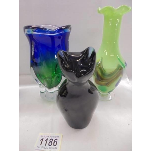 1186 - A pair of studio glass vases, another studio glass vase and a studio glass cat.