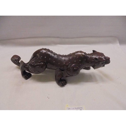 1188 - A bronze figure of a stalking leopard.