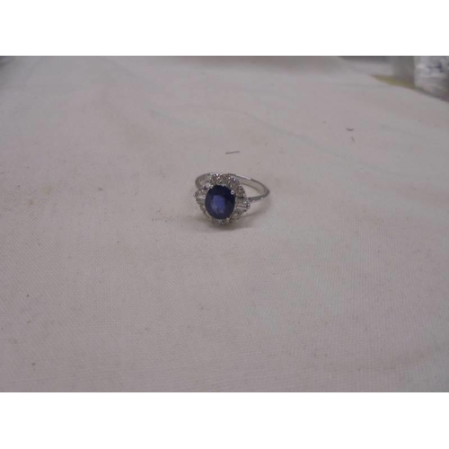 1197 - Certificated 18ct white gold oval sapphire and diamond cluster ring. Sapphire 2.34ct. Diamonds 0.57c... 