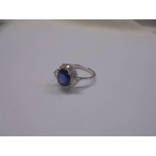 1197 - Certificated 18ct white gold oval sapphire and diamond cluster ring. Sapphire 2.34ct. Diamonds 0.57c... 