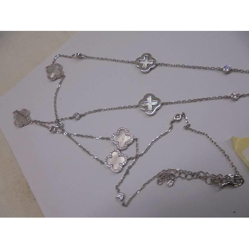 1213 - Long silver necklace alternately set with mother of pearl and white round cubic zirconia