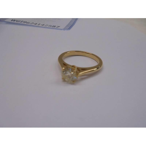 1214 - Certificated 18ct yellow gold RBC diamond 4-claw set solitaire ring. Diamond 0.67ct. Cert no. WGI962... 