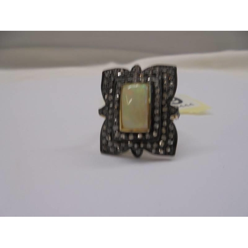 1219 - Rectangular cushion-cut Ethiopian opal ring set with rose-cut diamonds, in silver gilt. Opal 1.45ct.... 