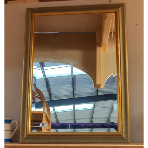 21 - A gilt framed bevel edged mirror, 84cm x 62 cm. COLLECT ONLY