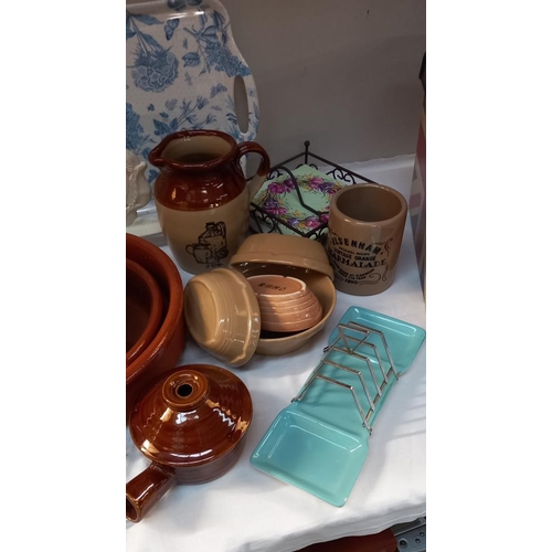 22 - A good lot of Kitchenalia including Stoneware jugs, Laura Ashley egg holder & toast racks etc