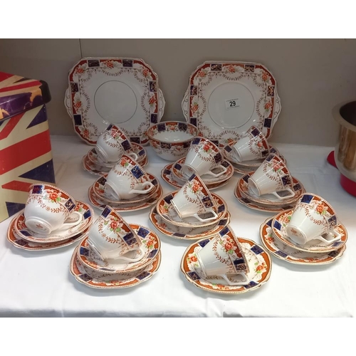 29 - A 1930s Bone China trio's cups & Saucers with cake plates