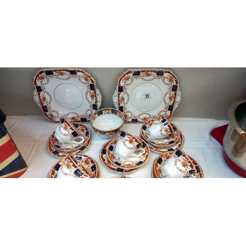 29 - A 1930s Bone China trio's cups & Saucers with cake plates