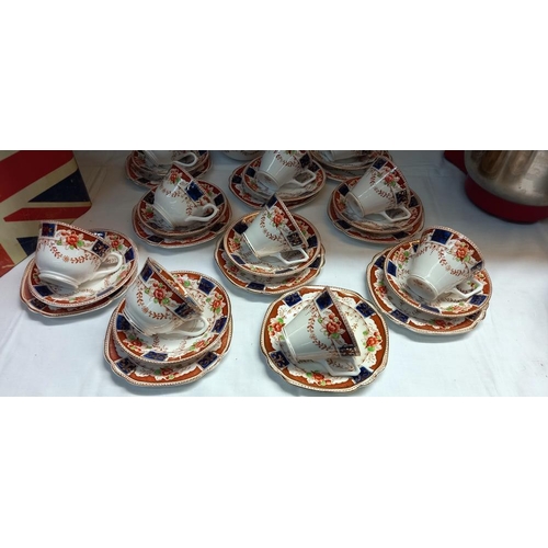 29 - A 1930s Bone China trio's cups & Saucers with cake plates