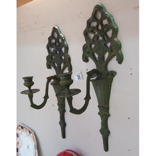 30 - A pair of cast iron wall candle holders