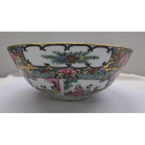 1256 - A Chinese Famille Rose porcelain bowl signed on base, 21 cm diameter.