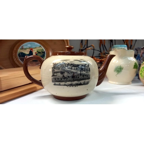 46 - A 1930's teapot with scenes of Ropsley. Christmas gift from A.F Rowell grocer & draper