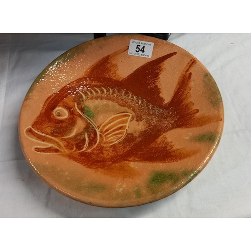 54 - A pottery plate depicting a fish