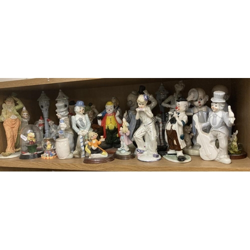 403 - 2 shelves of over 60 ceramic and other materials (resib etc) Clowns