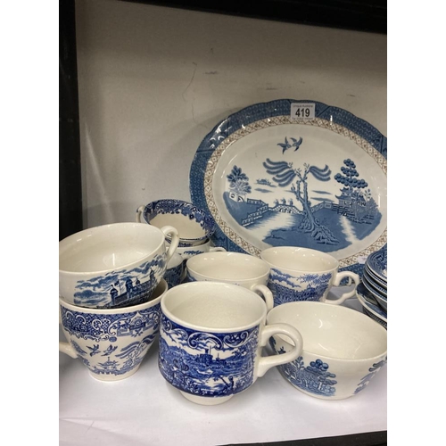 419 - selection of blue and white crockery Cups saucers plates bowls some willow pattern and others